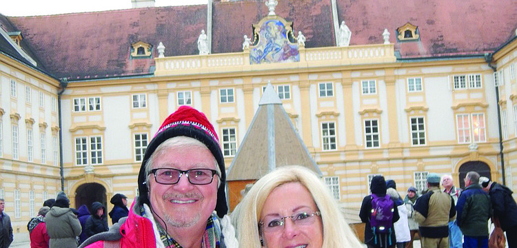 RIVER RENDEZVOUS. East County residents Chic and Robin Hansen read their East County Observer in front of the Melk Abbey along the Danube River in Austria. The couple enjoyed a riverboat cruise from Nuremberg, Germany, to Vienna.