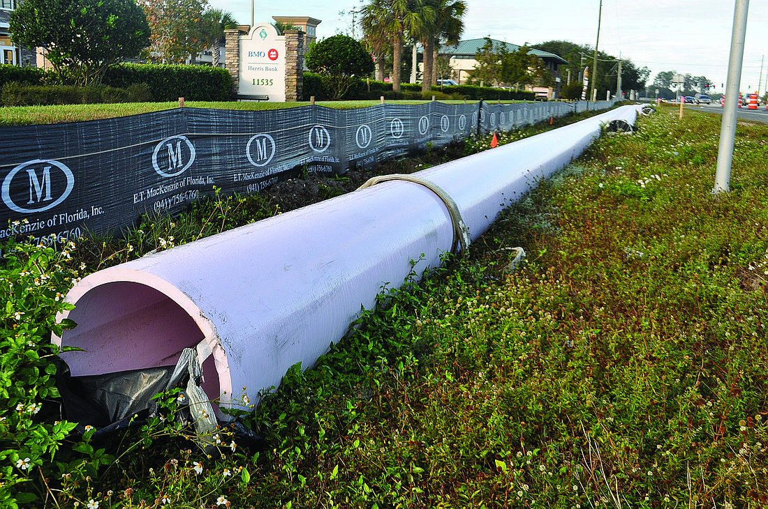 Pam Eubanks Reclaimed water pipes are being installed along State Road 70.