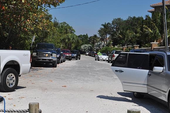 On busy days, cars crowd North Shell Road, making it difficult for residents to enter and leave their driveways. (File photo)