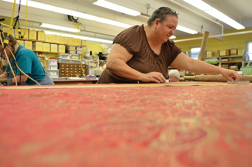 Beverly Fleck cuts a dress form