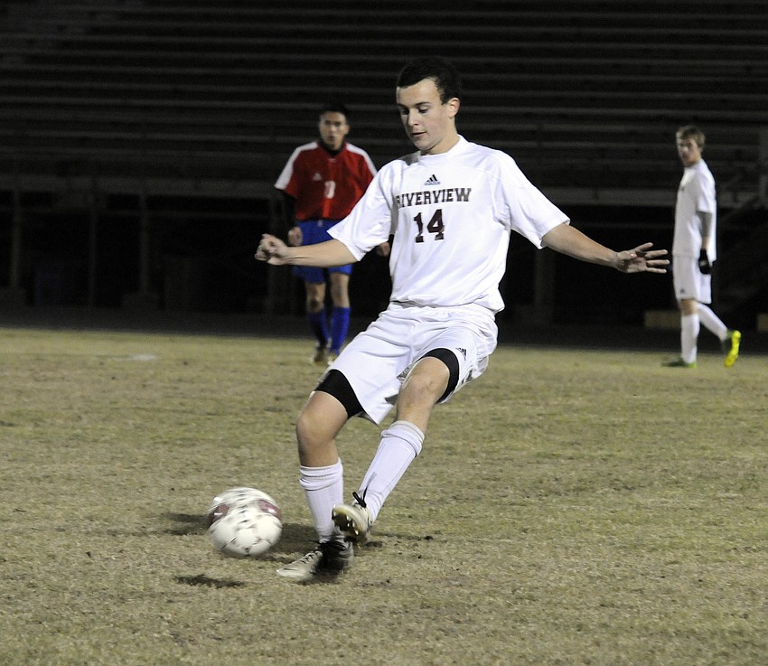 Riverview midfielder Etienne Behan kicks the ball up the field to a teammate late in the first half.