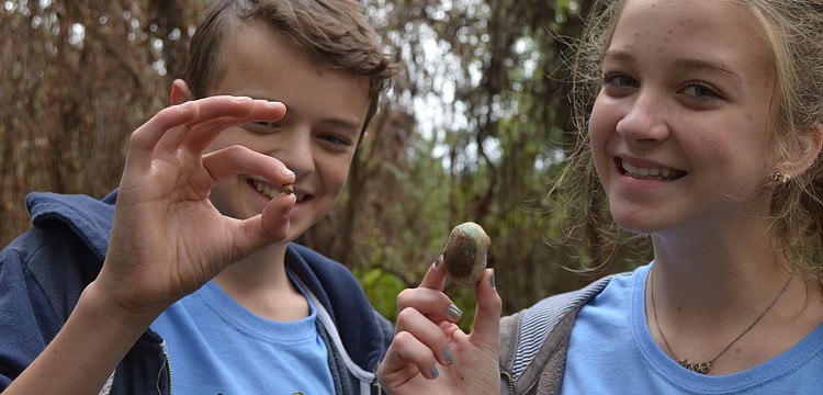 Seth Tucker and Olivia Lake compare their air potatoes.