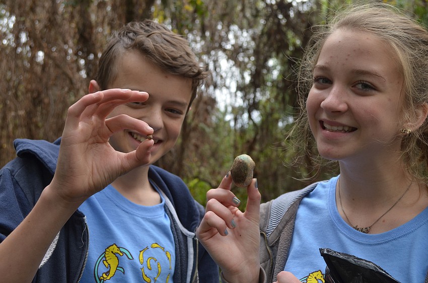Seth Tucker and Olivia Lake compare their air potatoes.