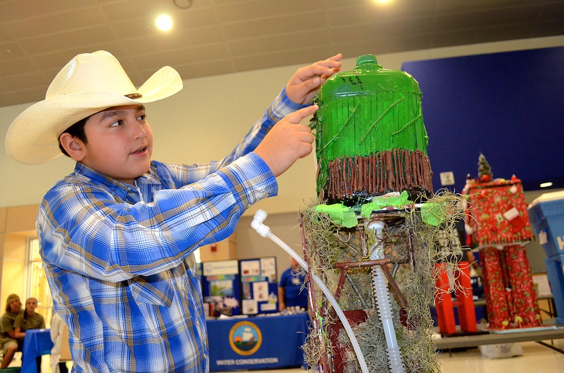 Photos by Amanda Sebastiano George Carino, 11, spent 85 cents on his tree house-themed water tower, which later won him $200 at the Model Water Tower Competition Jan. 25.