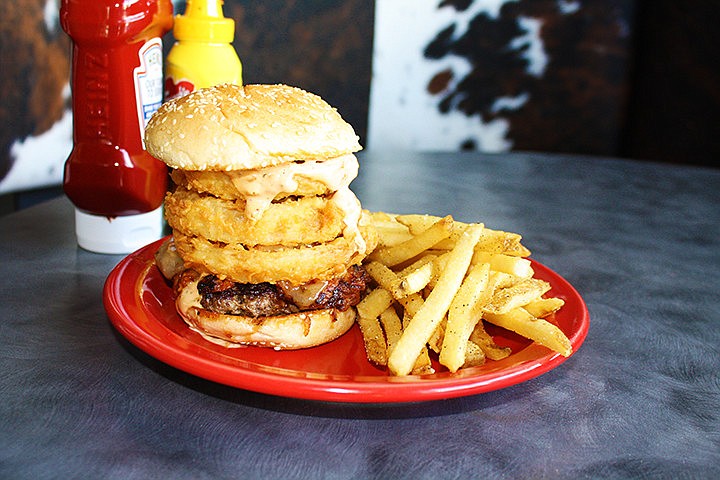 Square One Burgers & Bar offers a wide variety of specialty burgers including the Drunken Pig & Bull burger with BBQ pulled pork and fried onion rings.