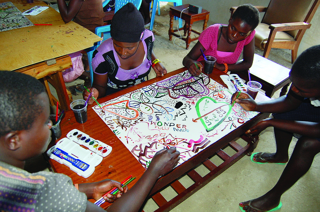 Courtesy photo Girls from the Kandaria Village participate in the collaborative painting-to-music exercise.