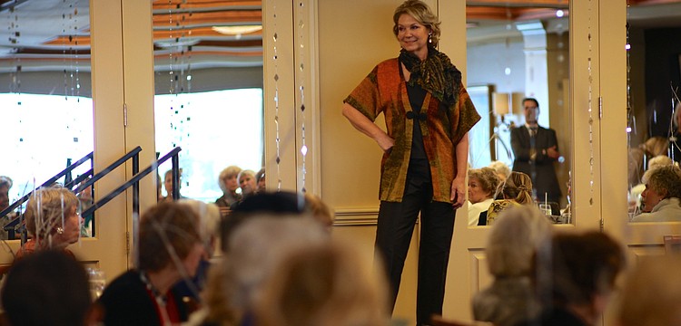 Lynn Hayes poses before walking down the runway.