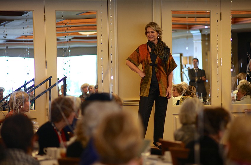 Lynn Hayes poses before walking down the runway.