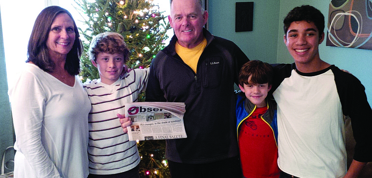 FAMILY TIME. Penny Klein and Les Brassington brought their Longboat Observer along while visiting their grandchildren, Brooks Dahl, Coleman Dahl and Grey Lancaster, in Lake George, N.Y.