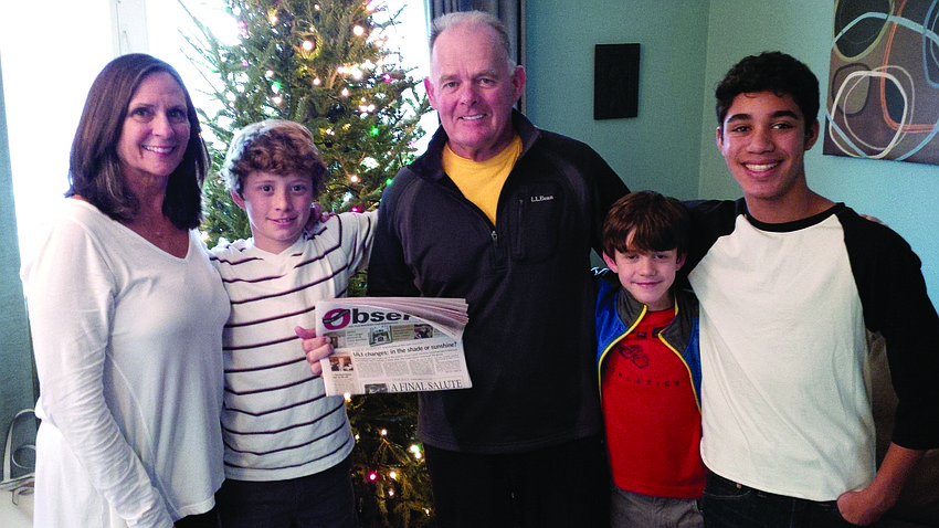 FAMILY TIME. Penny Klein and Les Brassington brought their Longboat Observer along while visiting their grandchildren, Brooks Dahl, Coleman Dahl and Grey Lancaster, in Lake George, N.Y.