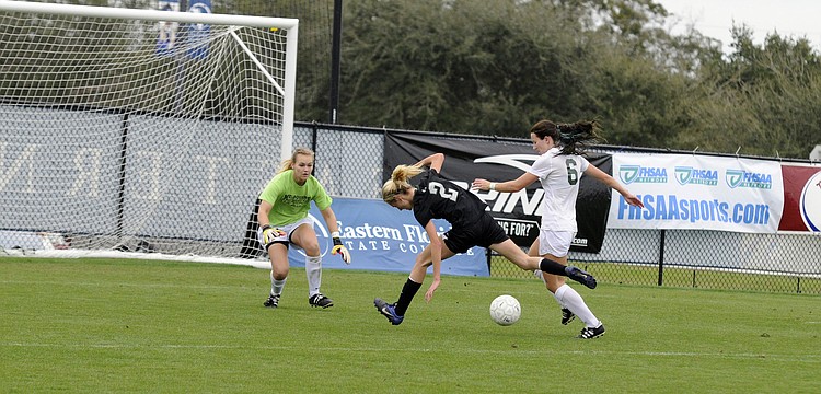 Lakewood Ranch freshman forward Sophia Falco is knocked off the ball by a Melbourne defender in the second half.