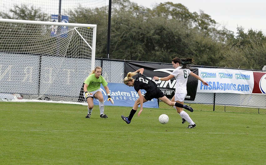 Lakewood Ranch freshman forward Sophia Falco is knocked off the ball by a Melbourne defender in the second half.
