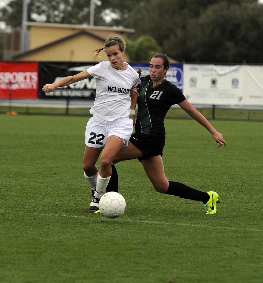 Lakewood Ranch sophomore Julia Ortiz battles a Melbourne defender for possession in the first half.