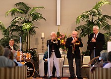 The musicians perform for a full house.