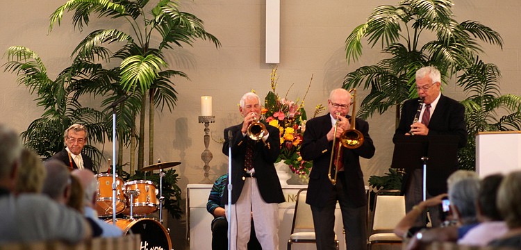 The musicians perform for a full house.