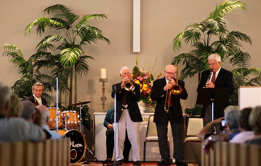 The musicians perform for a full house.