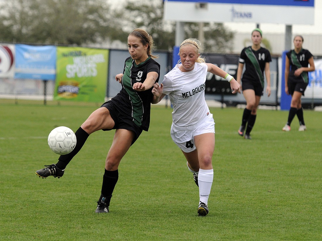 Lakewood Ranch midfielder Maria Miller attempts to maintain possession for the Lady Mustangs.