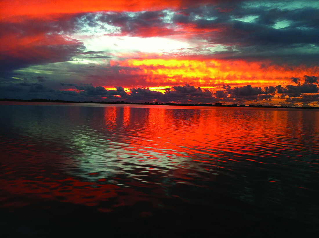 Ed Kolodzieski snapped this sunset photo, taken from his catamaran, Enchanted.