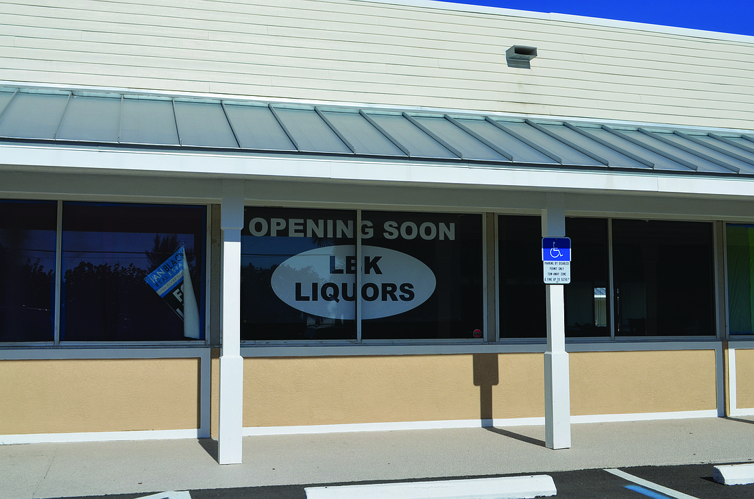 Kurt Schultheis A sign appeared over the weekend in Whitney Beach Plaza announcing a new liquor store.