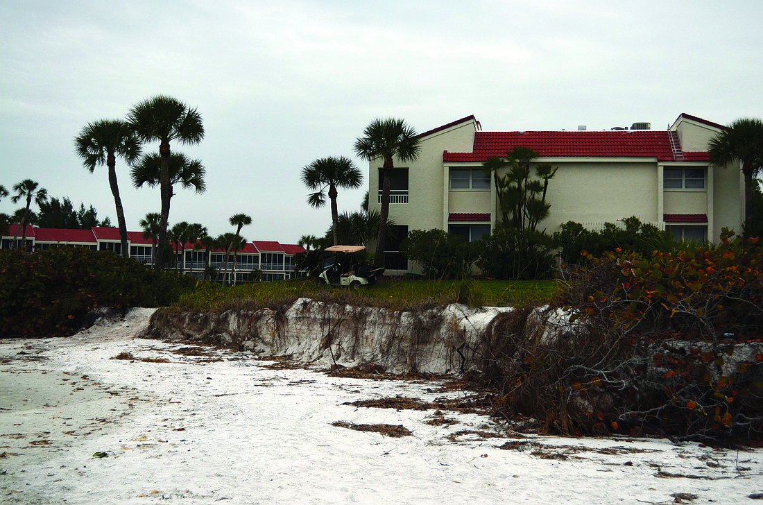 Kurt Schultheis Longbeach condominiums is considering extending its seawall to protect the Periwinkle building. Gulf water is eroding the property near that building at high tide.