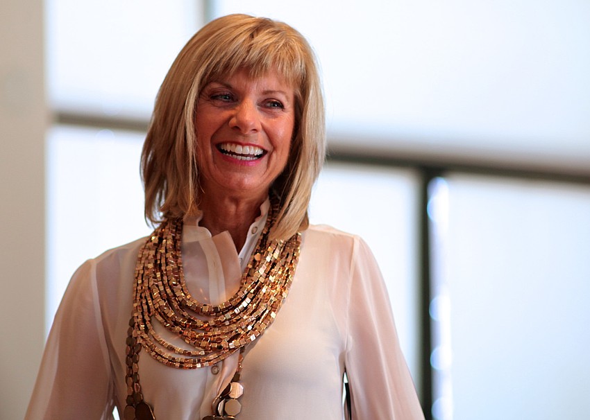 Karen MacIntosh smiles in her special Chicoâ€™s Black Label outfit.