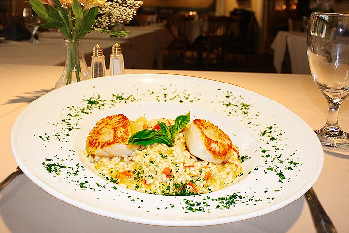 Cafe Baci serves classic Italian dishes with specialties in Roman and Tuscan cuisine.