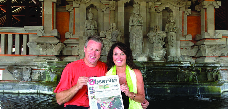 CELEBRATORY COUPLE. Sarasota residents Dr. Greg and Jeri Lynn Towsley brought their Sarasota Observer along on their recent anniversary trip to Bali, Indonesia.