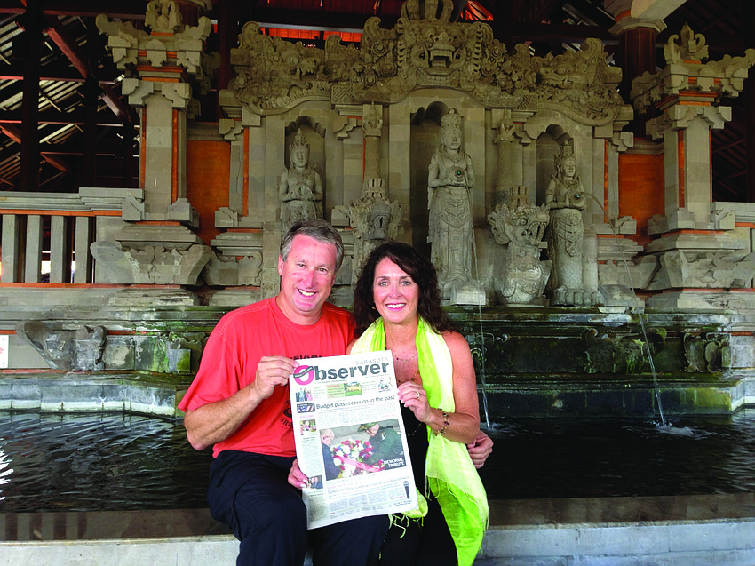 CELEBRATORY COUPLE. Sarasota residents Dr. Greg and Jeri Lynn Towsley brought their Sarasota Observer along on their recent anniversary trip to Bali, Indonesia.