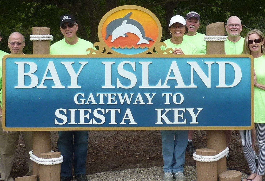 Members of the Bay Island-Siesta Neighborhood Association with the new sign