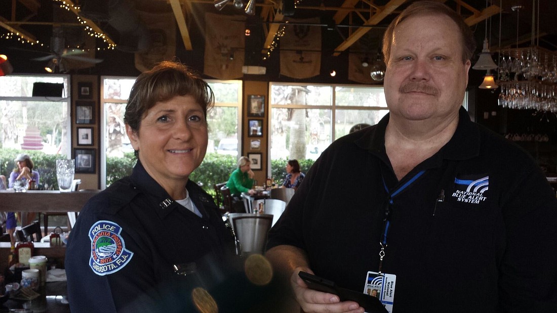 Officer Linda Senior, with the Crime Prevention Unit, and Tom Berry, founder of the Blue Alert Foundation