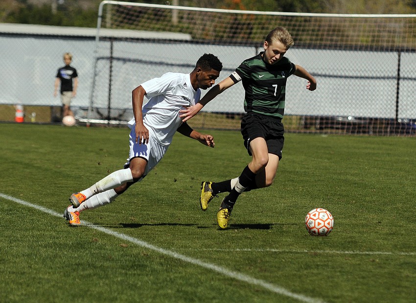 Lakewood Ranch junior Jake Dube crosses the ball back to the middle of the field in the first half.