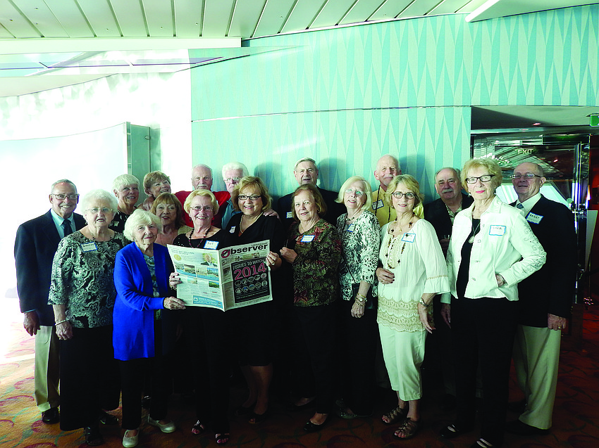 SEAS THE MOMENT. Residents of Spanish Main Yacht Club enjoyed reading the Longboat Observer during a January cruise to Grand Cayman Island and Cozumel, Mexico, on Royal Caribbean's Brilliance of the Seas.