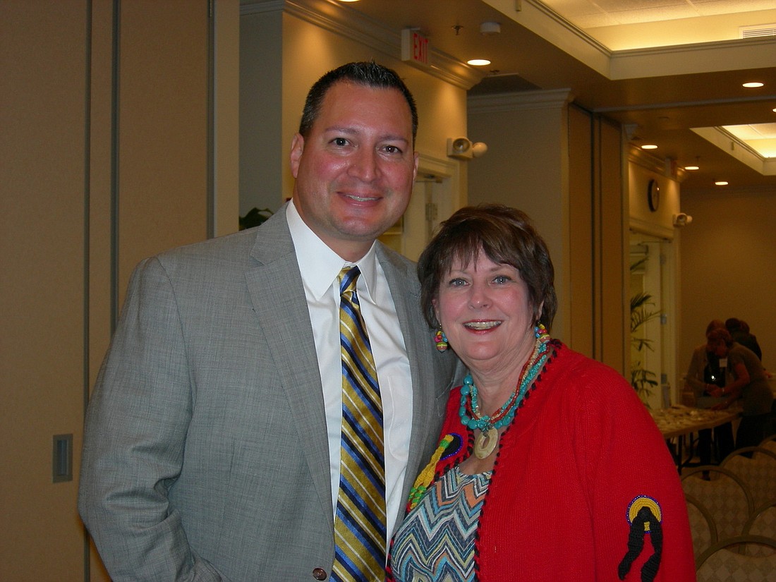 Octavio Ortiz, general manager of The Mall at University Center, with Lakewood Ranch WomenÃ¢â‚¬â„¢s Club President Trish Newman