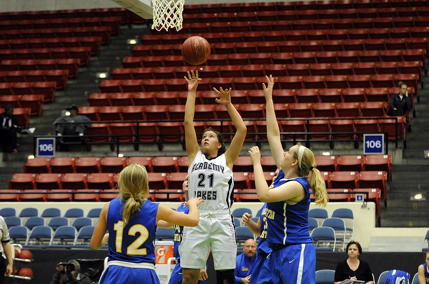 Sarasota Christianâ€™s McKenzie Lantz and Anikka Jensen go up for a rebound.