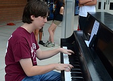 Fifteen-year-old Brian Long focuses on the music.
