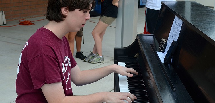 Fifteen-year-old Brian Long focuses on the music.