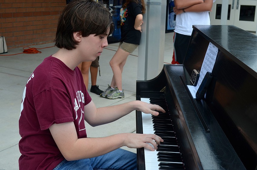 Fifteen-year-old Brian Long focuses on the music.