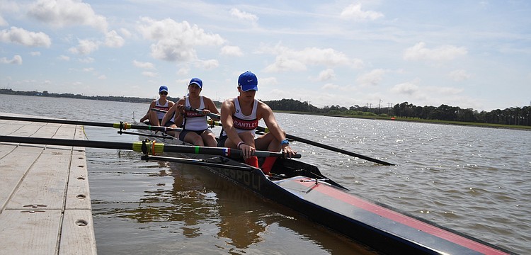Brantley High School rowers push off.