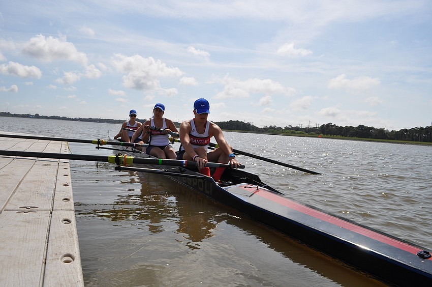 Brantley High School rowers push off.