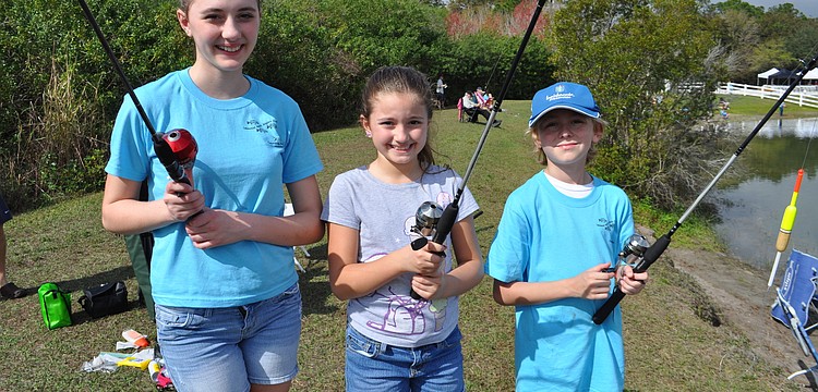 Gianna and Gabriella Pento fish with their friend Michael McQueeny.