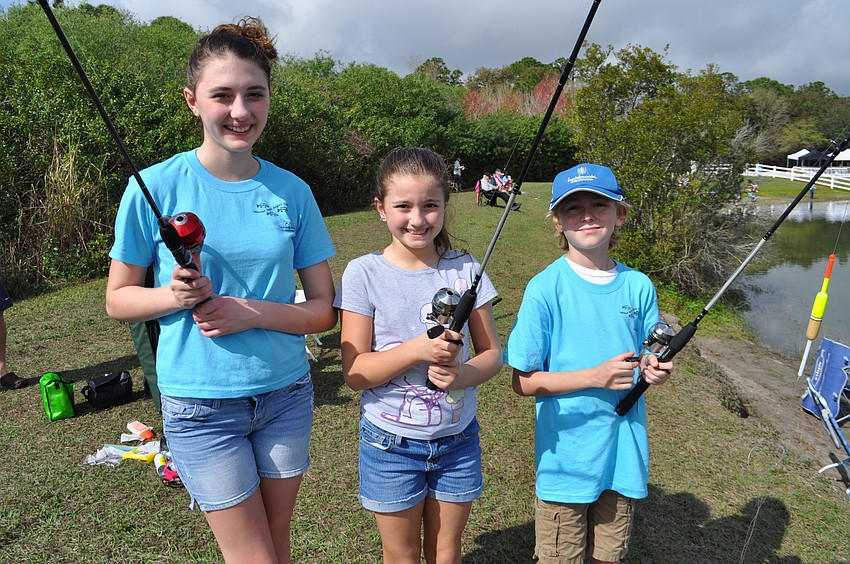 Gianna and Gabriella Pento fish with their friend Michael McQueeny.