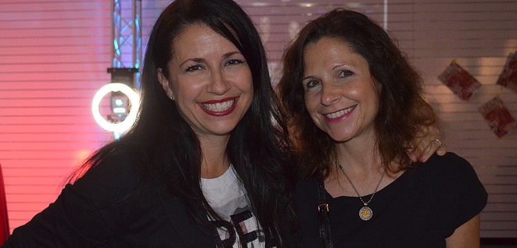 Sisters Kay Mathers and Jill Jaiswal hang out before the program.
