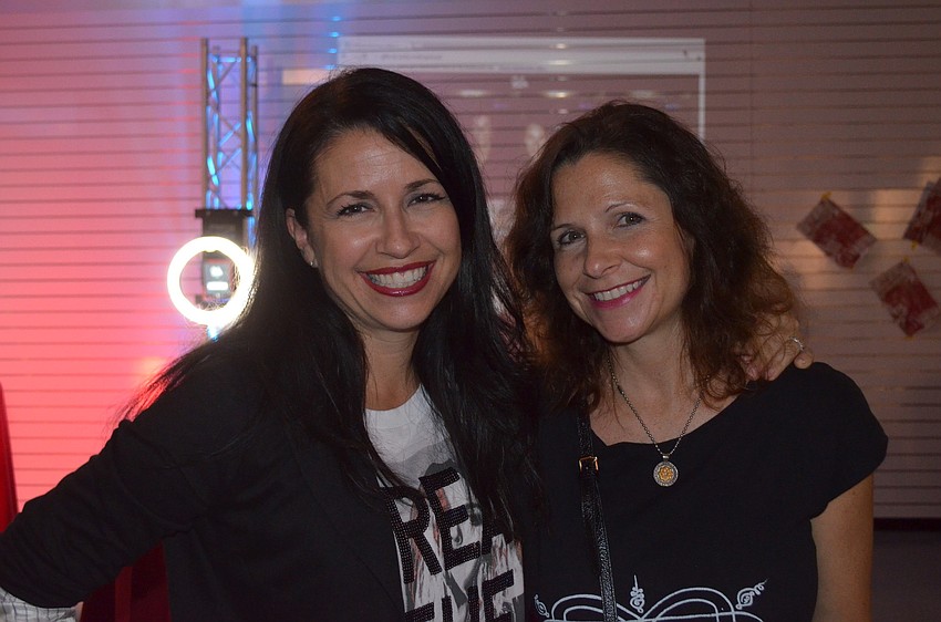 Sisters Kay Mathers and Jill Jaiswal hang out before the program.