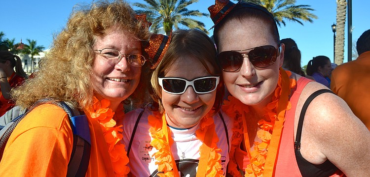 Sharon Morehouse, Amanda Sessions and Crystal Schroeder show off their orange pride.
