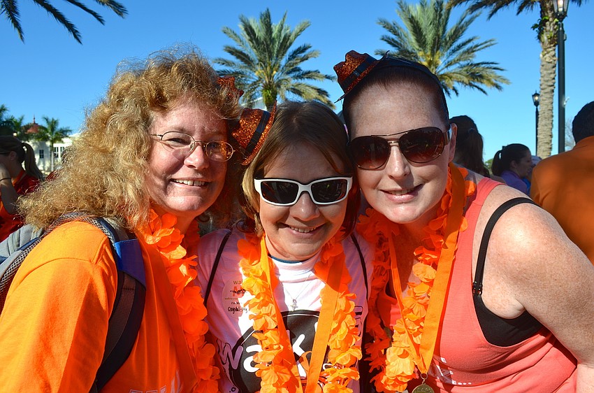 Sharon Morehouse, Amanda Sessions and Crystal Schroeder show off their orange pride.