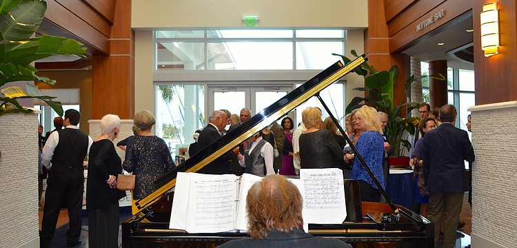 Gary DeMichele entertains attendees with the piano.