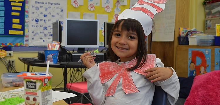 Chloe Marroquin with her second serving of green eggs and ham.