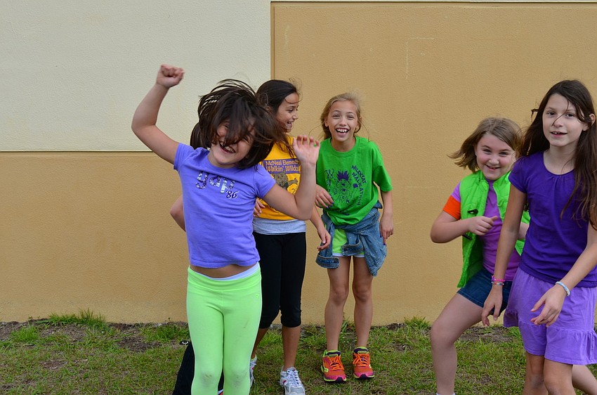 McNeal Elementary students dance around to pop songs after participating in the Walk-a-thon.