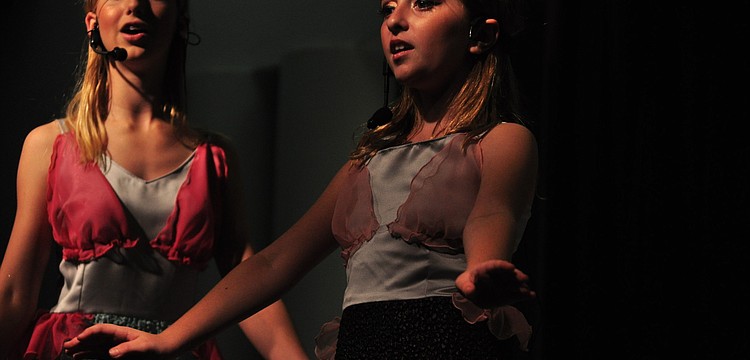 Emily Weott and Kaitlyn Scirica dance to "Sheâ€™s in love."