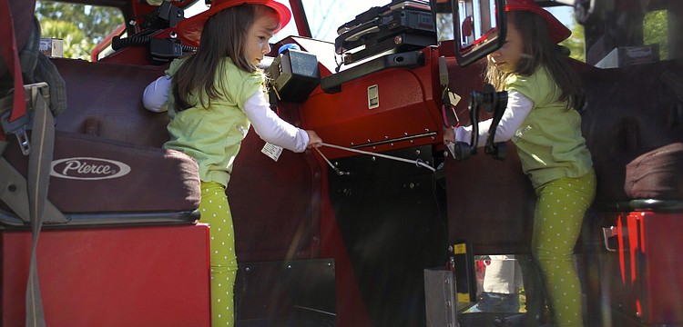 Zuleika Zunz rings the bell on the fire truck.